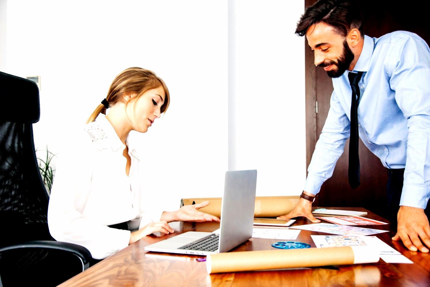 Professional financial planning meeting with documents and calculators spread across conference table